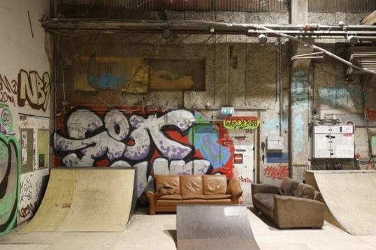 Image of an enclosed space, with a couch and ramps